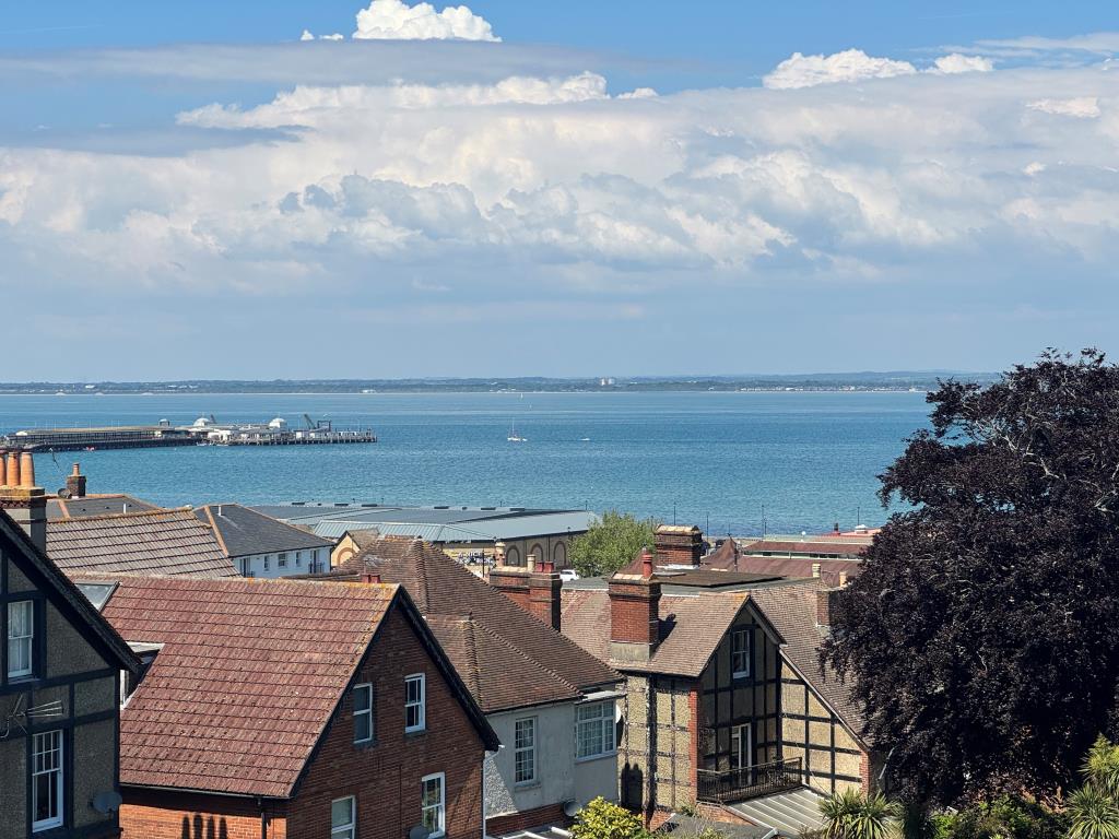Lot: 156 - TWO STOREY THREE-BEDROOM FLAT FOR IMPROVEMENT WITH STUNNING SEA VIEWS AND PLANNING FOR SPLITTING IF PREFERRED - The View of Ryde Pier and The Solent